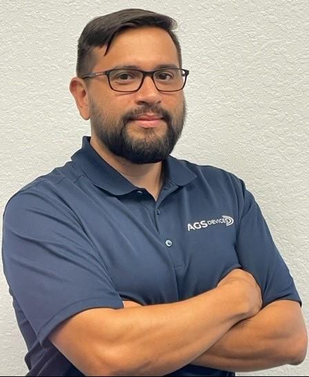 Douglas Zamith, Business Development Specialist at AGS Devices, in a light blue AGS Devices t-shirt.